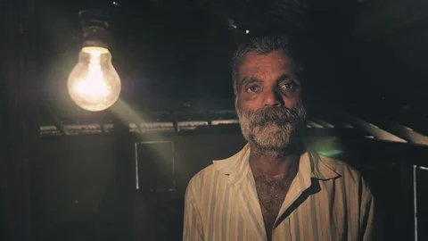 A Indian farmer looking  when he first time receives the electricity Stock Footage 90140308