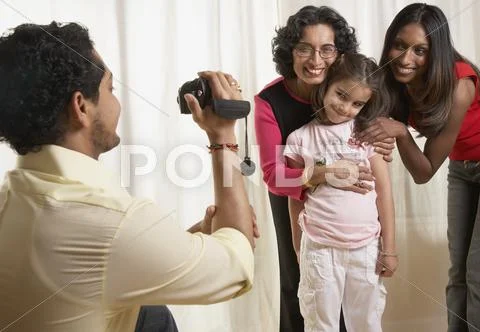 Indian father video recording family Stock Photos