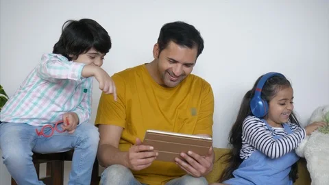 Indian father watching funny videos with... | Stock Video | Pond5 Indian father watching funny videos with... | Stock Video | Pond5