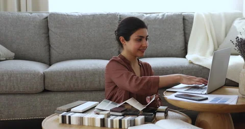 Indian female architect designer develop house interior project on pc Stock Footage 165534579