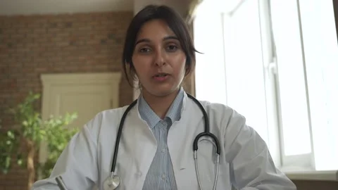 Indian female doctor talking to Stock Video Pond5