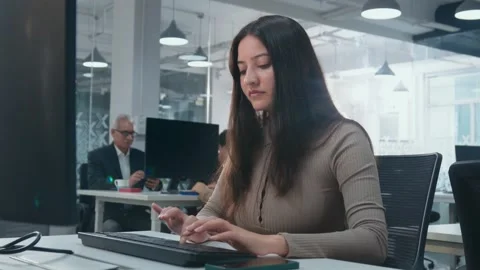 Indian female Entrepreneur working on computer in modern start-up office Video stock 242575418