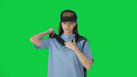 Indian female security guard getting ready for duty Green screen Stock Footage 250264840