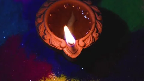 Indian festival of lights Loop 4K background Diya lamp with fire lighting for Video stock 336450376