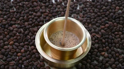 Indian filter coffee in a brass cup 動画素材 228665174