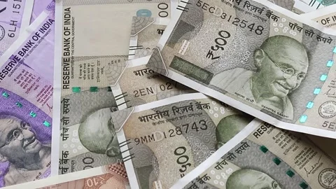 Indian five hundred rupee banknotes are placed on top of Indian rupees Stock Footage 302582145