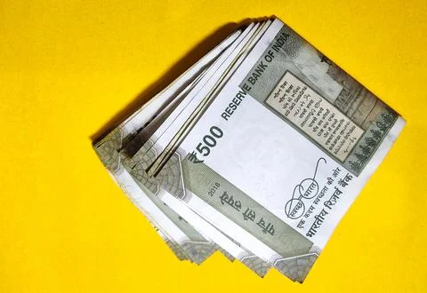 Indian five hundred rupee notes on the yellow background Stock Photos