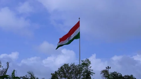 A indian flag is flying in blue sky Stock Footage 247373870
