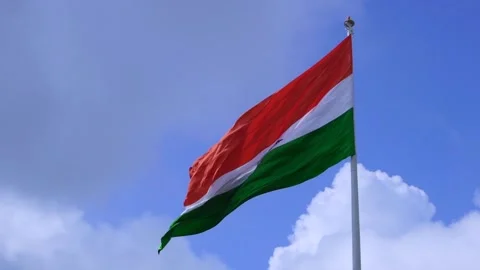 A indian flag is flying in blue sky Stock Footage 247373901