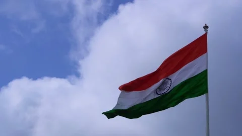 A indian flag is flying in blue sky Stock Footage 247373908