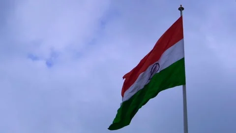 A indian flag is flying in blue sky Stock Footage 247373933