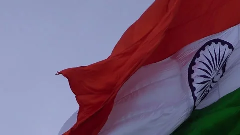 A indian flag is flying in blue sky Stock Footage 247373941
