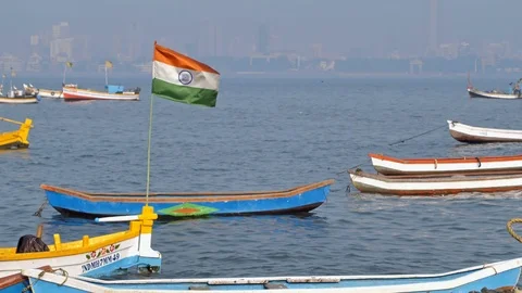 Indian flag waving installed on one of the colorful fishing boats Stock Footage 89886938