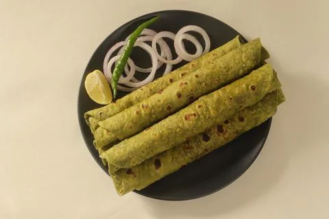 Indian flatbread made with whole wheat flour kneaded with pureed Indian spina Stock Photos