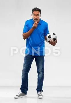 Indian football coach with soccer ball and whistle Stock Photos