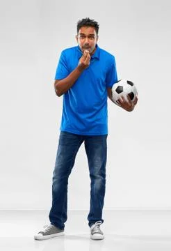 Indian football coach with soccer ball and whistle Stock Photos