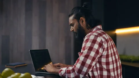 Indian freelancer writing code on laptop, working remotely on programming task Stock Footage 313281420