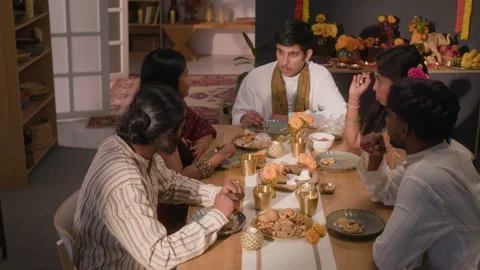 Indian Friends Having Festive Conversation at Dining Table Stock Footage 344964085