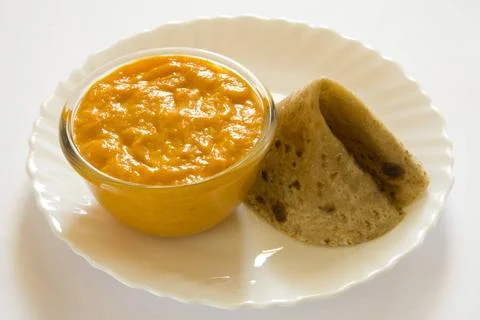 Indian fruit mango pulp with paratha Indian bread served in bowls and plat... Stock Photos
