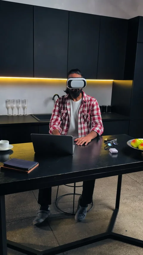 Indian game designer troubleshooting VR headset at home, virtual reality project Stock Footage 316838642