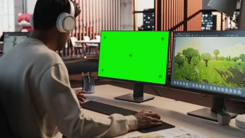 Indian Game Developer Using Chromakey Computer In Office Stock Footage 255794887