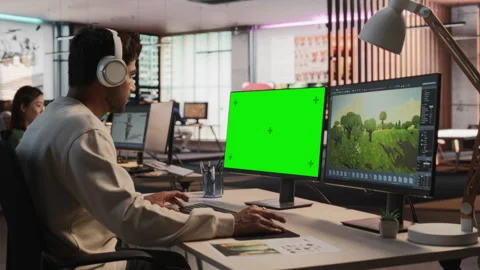 Indian Game Developer Using Chromakey Computer In Office Stock Footage 255794981