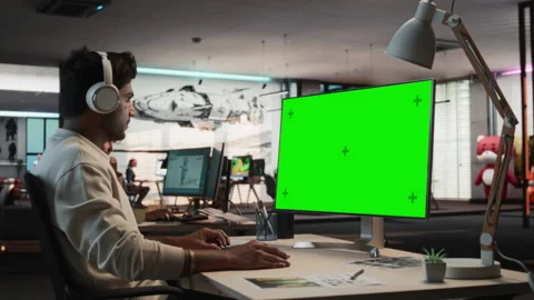 Indian Game Developer Using Chromakey Computer In Office Stock Footage 255795847