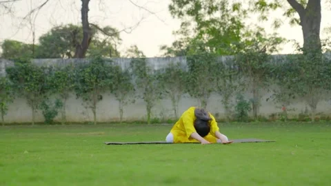 Indian girl basic yoga pose Video stock 242085225