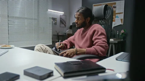 Indian Graphic Designer Working on Graphics Tablet in Office Stock Footage 348346826