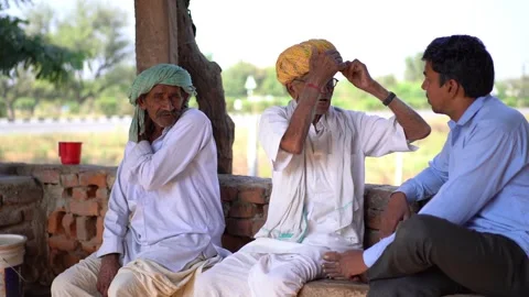 Indian Group of multi generation People gossiping relaxing Stock Footage 255346777