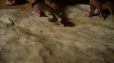 Indian Hands Cleaning a Paper Stock Footage 58070747