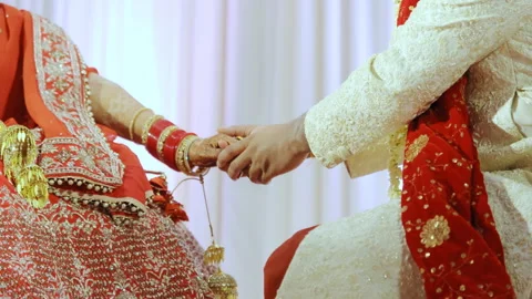 indian punjabi wedding couple holding hands