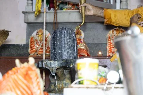 Indian Hindu Devotee Performing Shiva Puja Inside Traditional Temple Sanctuar Stock Photos