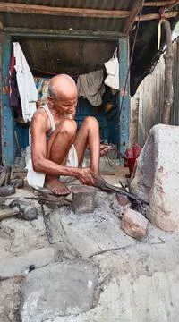 Indian iron man working village Stock Photos