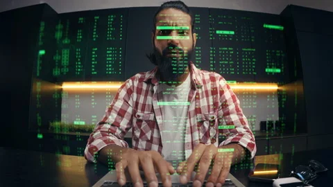 Indian IT specialist typing programming code on holographic computer display Stock Footage 329506705