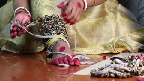 Indian Kathak Classical Dancer In Traditional Dress Tie Ghungroo Ghungru Stock Footage 149947072