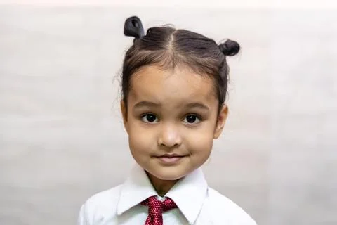 Indian kid cute expression getting ready for first day of school shirt and .. Stock Photos
