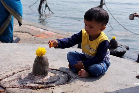 Indian kid worshiping Stock Photos