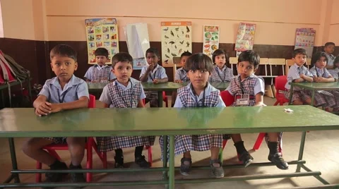 Indian kids sitting at the desks and waving Stock Footage 49322453