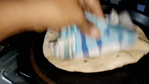 Indian Kitchen - Making of Chapati - making of  Roti or pulka -HD(4k) Stock Footage 222842725