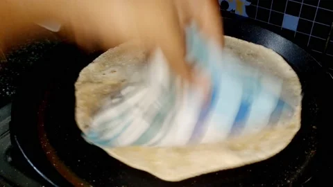Indian Kitchen - Making of Chapati - making of  Roti or pulka -HD(4k) Video stock 222842774