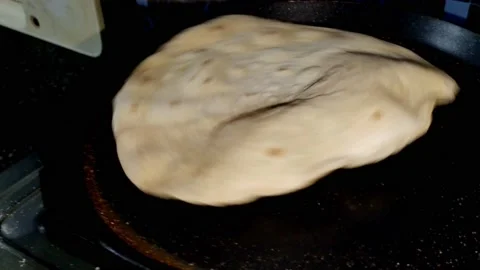 Indian Kitchen - Making of Chapati - making of  Roti or pulka -HD(4k) Video stock 222843509