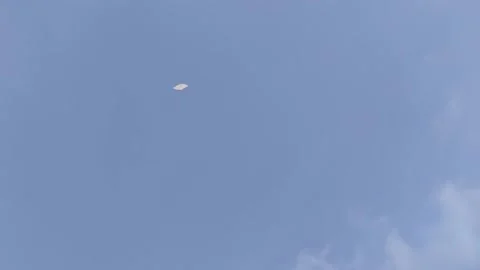 Indian kite flying in the blue sky on the ropes Stock Footage 234936986