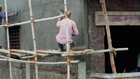 Indian labour working on construction site Stock Footage 250323209