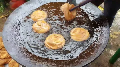 Indian  lacha paratha  deep  fried  on the street. Stock Footage 170956922