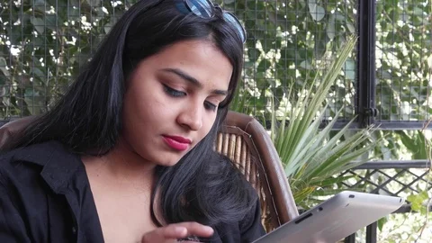 Indian lady working on a tablet with a keyboard computer in Rajasthan, India Stock Footage 70542898