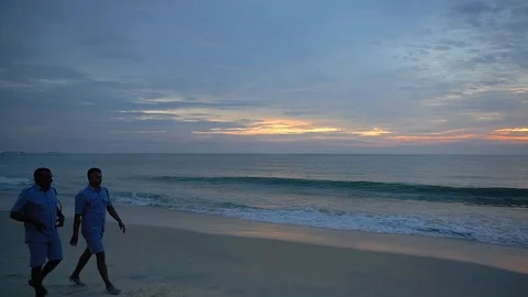 Indian lifeguards on a beach Stock Footage 121152514