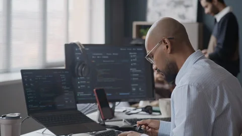 Indian Male Programmer Coding on Computers during Lunch Break in Office Vidéo 337484189
