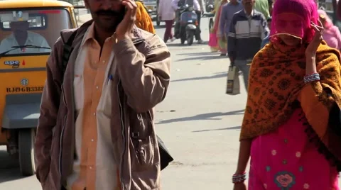 Indian man and woman on cell phone Stock Footage