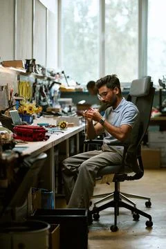 Indian Man Assembling Electronic Components in Robotics Workshop Stock Photos
